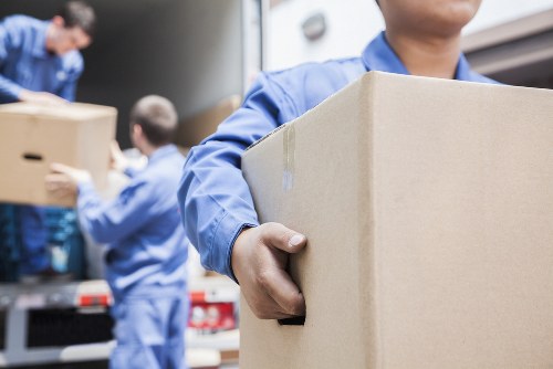 Removal team helping with Docklands apartment moving and loading access