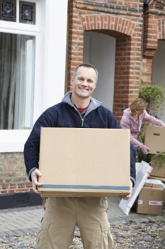 Man and van loading furniture near Docklands apartments