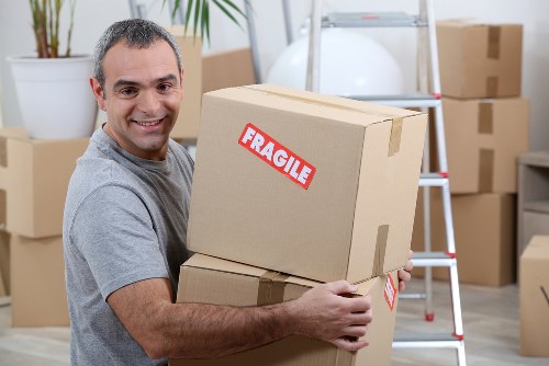 Docklands apartment moving service with lift access and packed boxes
