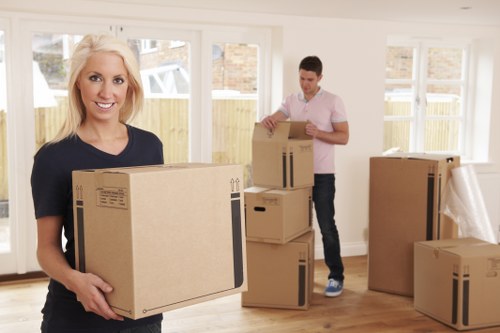 Professional movers handling furniture and boxes during a local Docklands house move