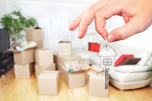 Moving team handling boxes and furniture in Docklands