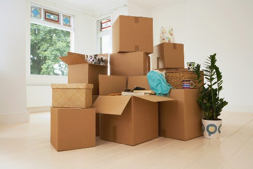 Removalists handling boxes and home furniture in Docklands