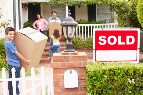 Professional movers packing household items for a Docklands relocation